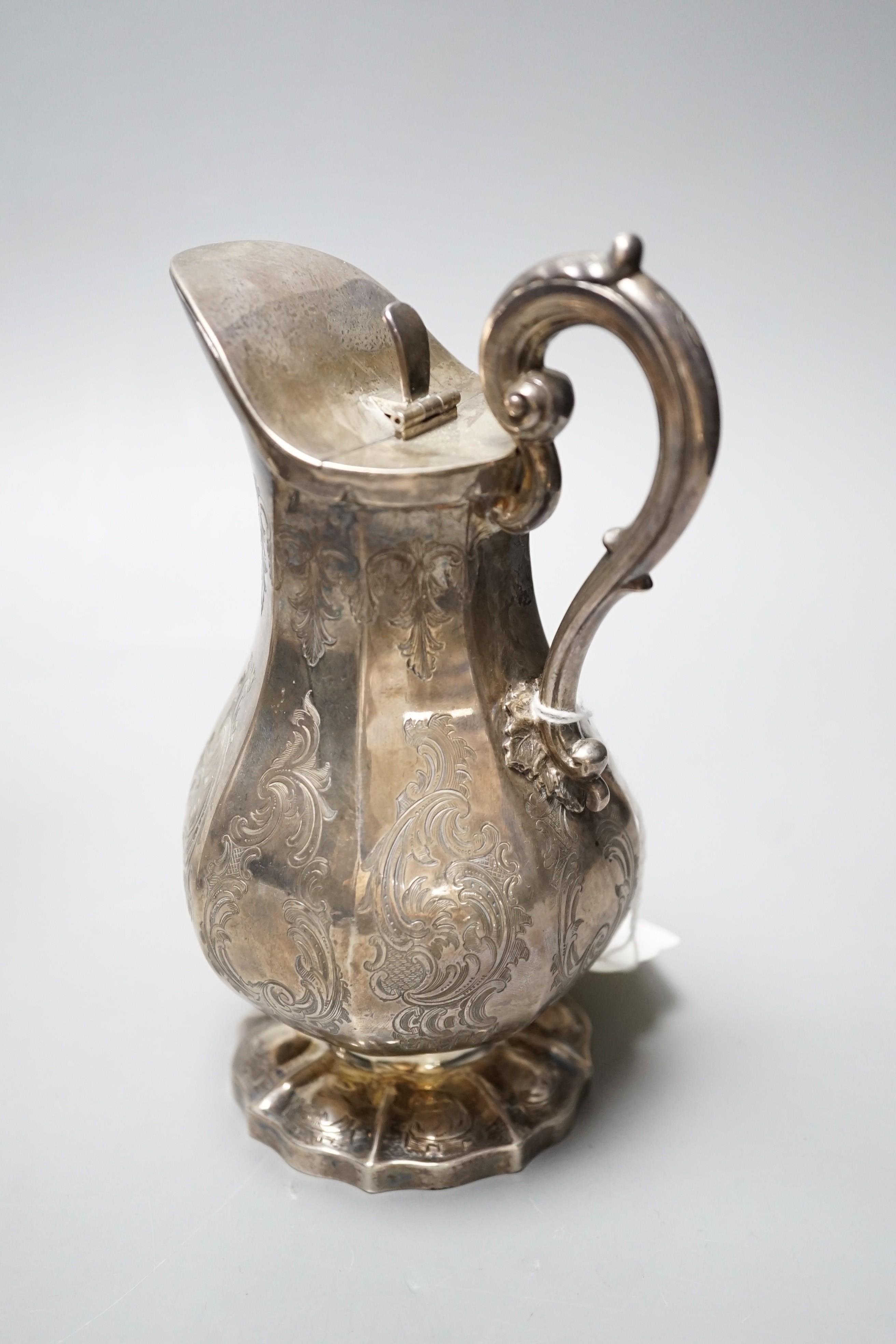 An early Victorian panelled pear shaped silver lidded cream jug, Charles & George Fox, London, 1845, 16.7cm, 9.5oz.